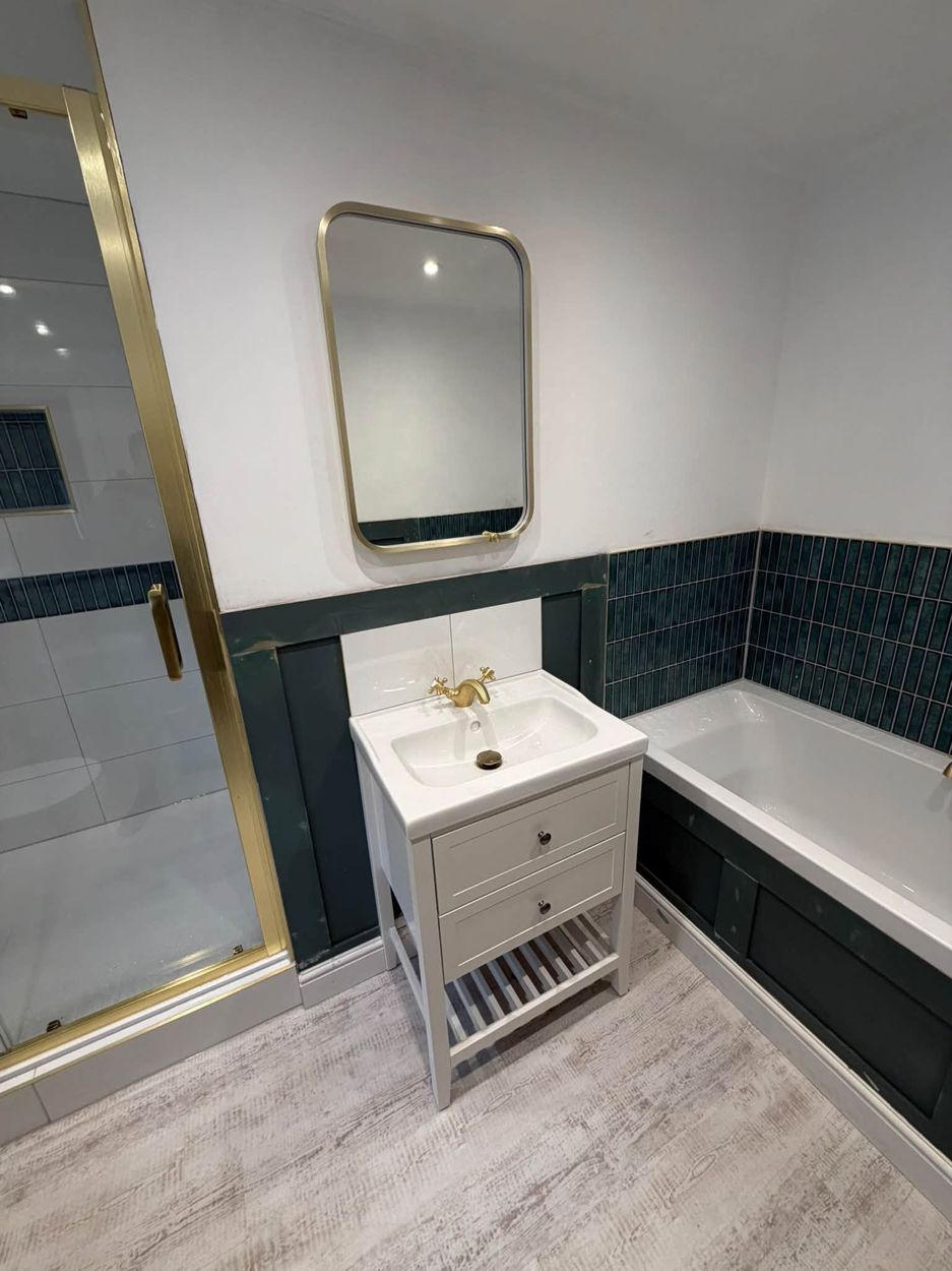 Bathroom refit in green tile and brushed brass
