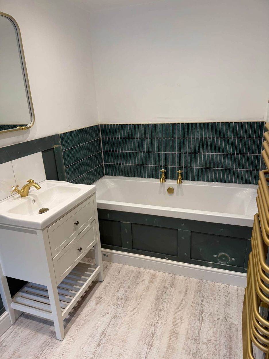 Vanity unit and panelled bath